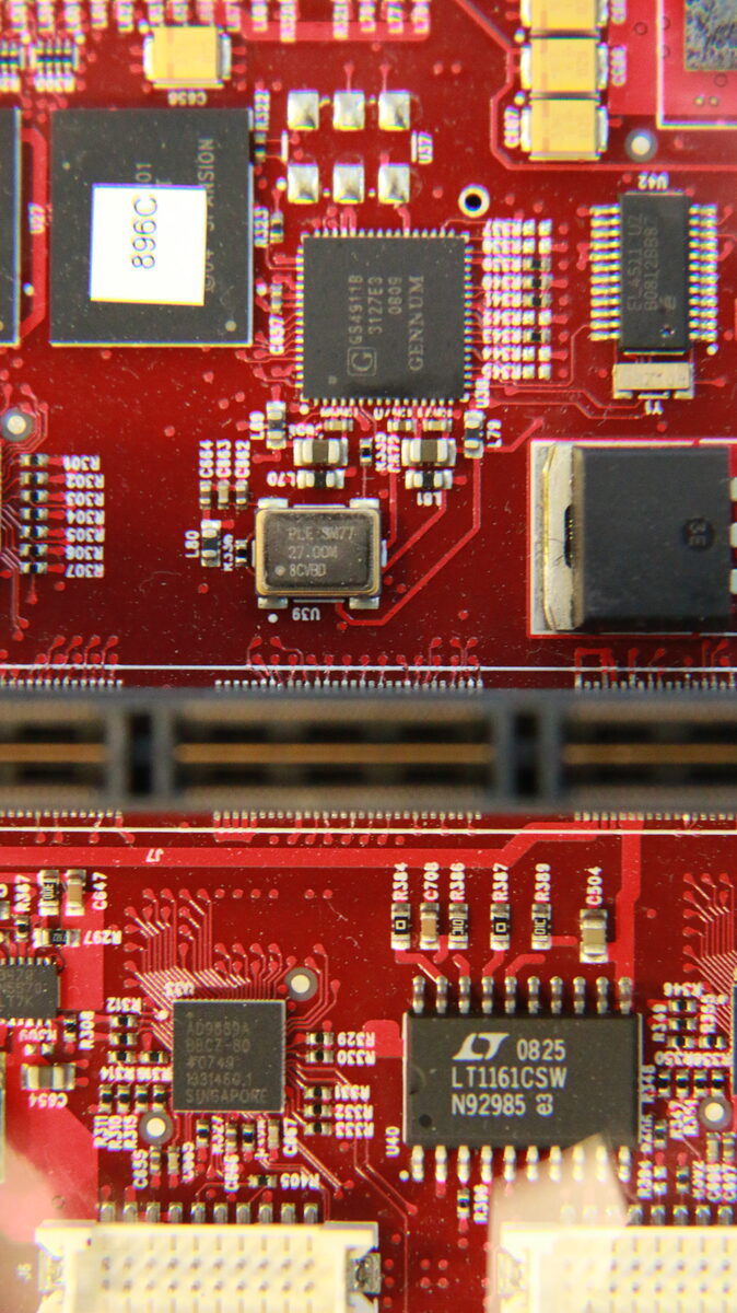 Close-up of CPU_IO board showing Gennum GS4911B chip and fine PCB traces near the mezzanine area